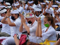 Mass prayer in Bali as island prepares to reopen to tourists