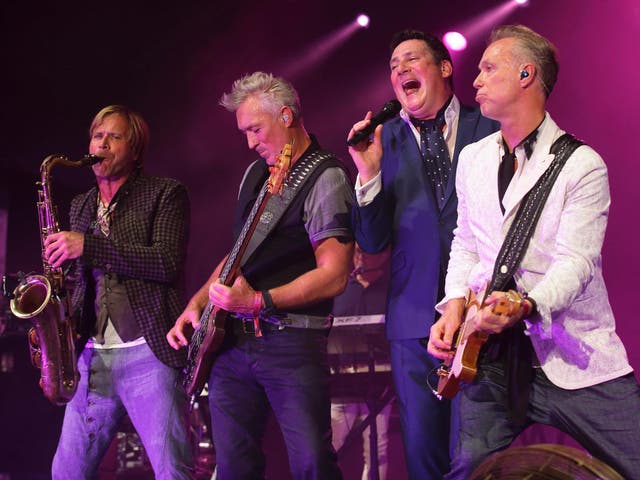 Tony Hadley (2nd right) performing with Spandau Ballet in 2015