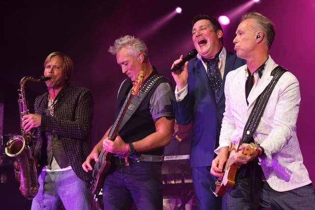 Tony Hadley (2nd right) performing with Spandau Ballet in 2015