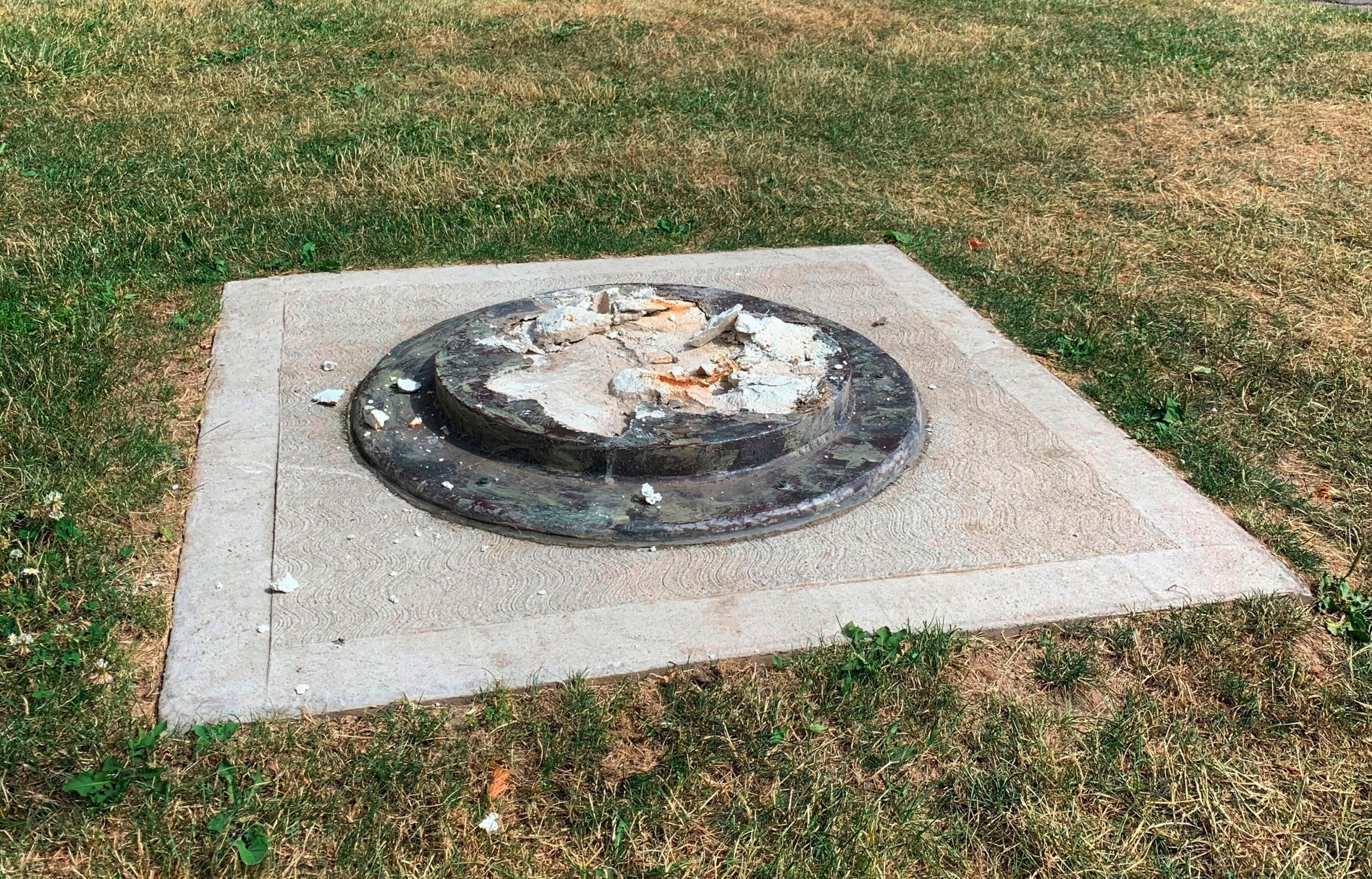 The remnants of a Frederick Douglass statue ripped from its base at a park in Rochester, New York