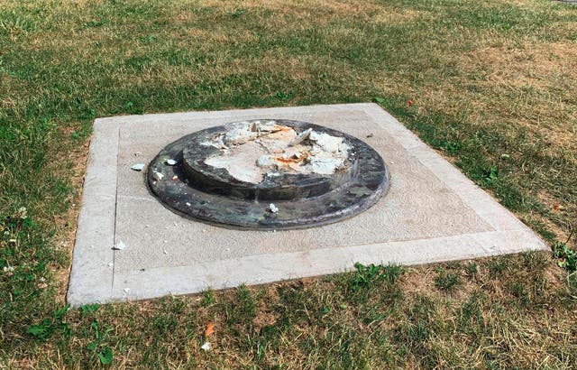 The remnants of a Frederick Douglass statue ripped from its base at a park in Rochester, New York