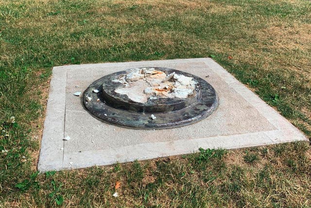 The remnants of a Frederick Douglass statue ripped from its base at a park in Rochester, New York