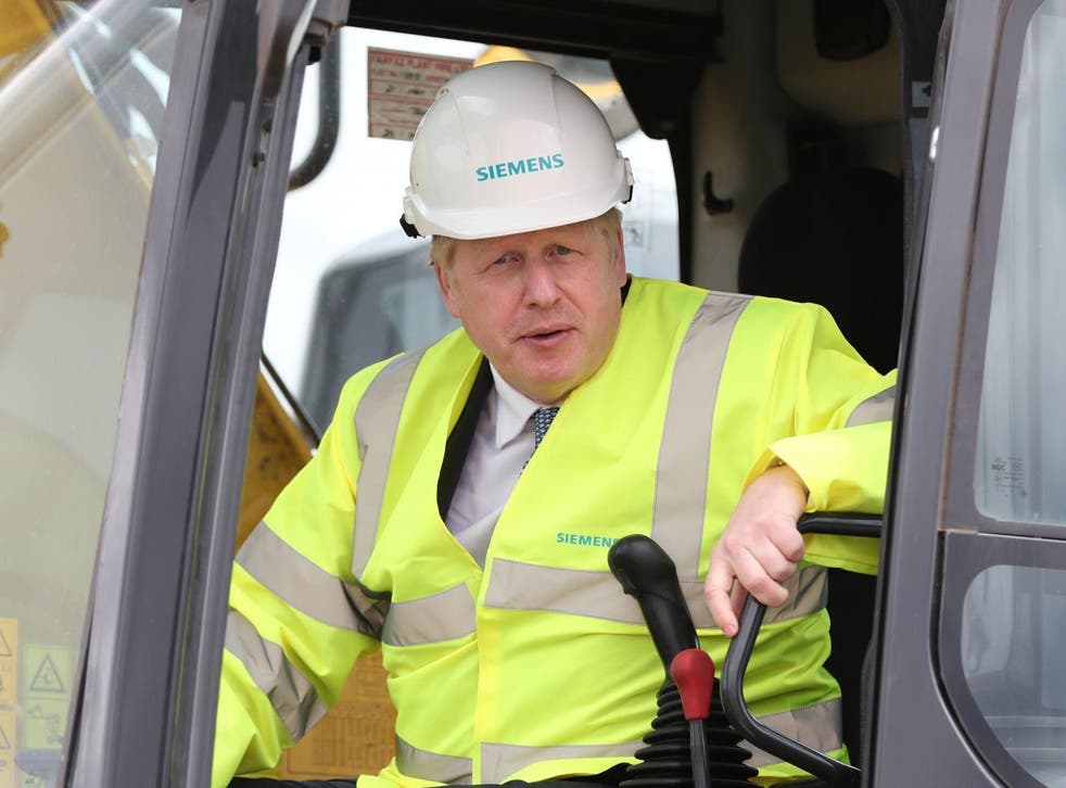 Boris Johnson in the cab of a digger during a visit to the Siemens Rail factory construction site in Goole