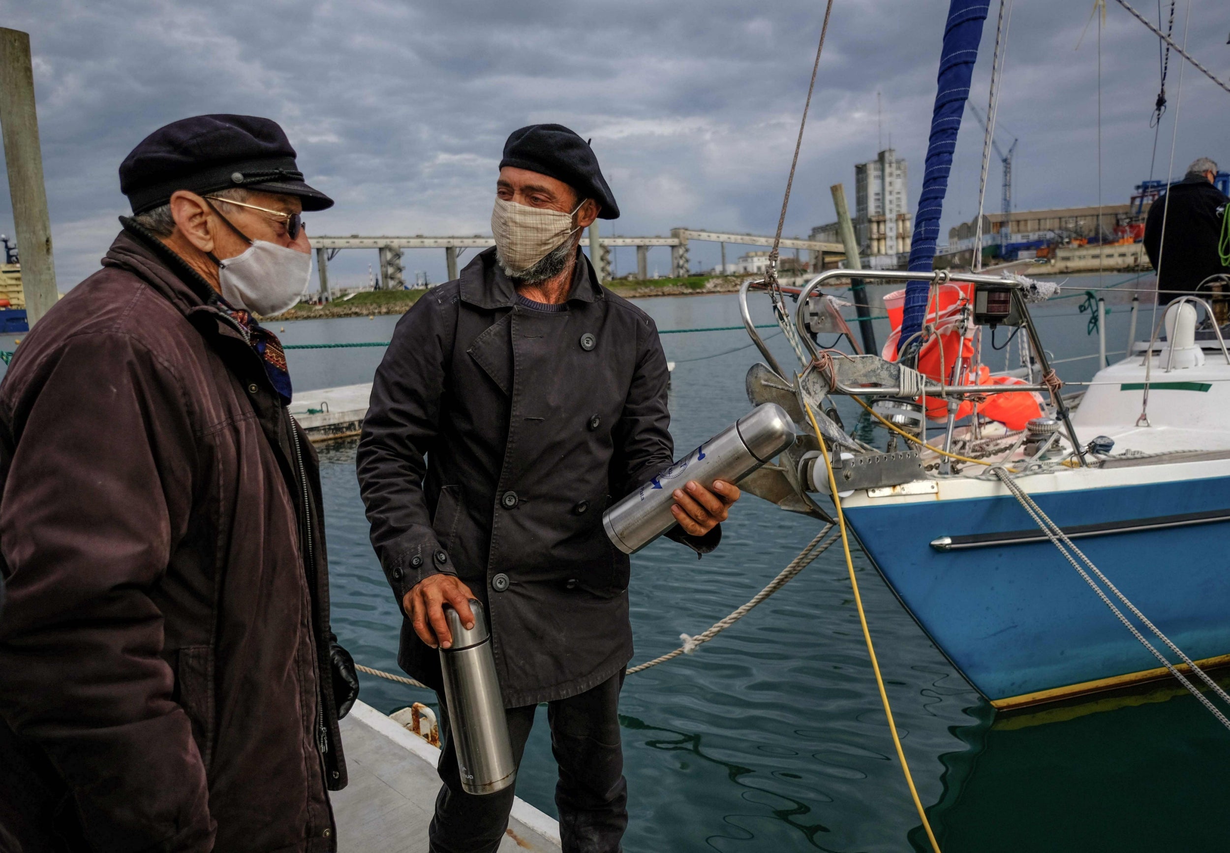 Juan Manuel Ballestero, right, speaks to his father Carlos upon arrival in Mar del Plata (Telam/AFP/Getty)