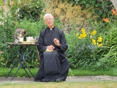 Cat drinks Dean of Canterbury's milk during online prayer service