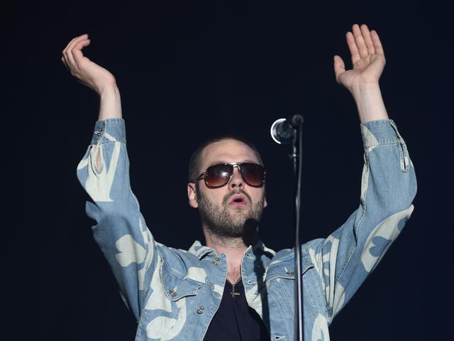 Performing with Kasabian in 2015