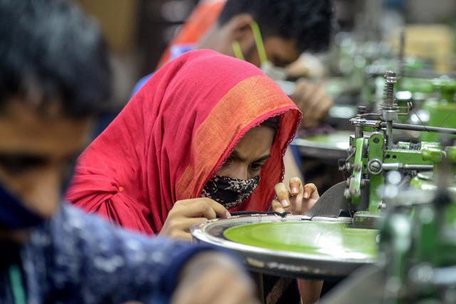 Factory workers make garments in Savar, Bangladesh on 18 June, 2020