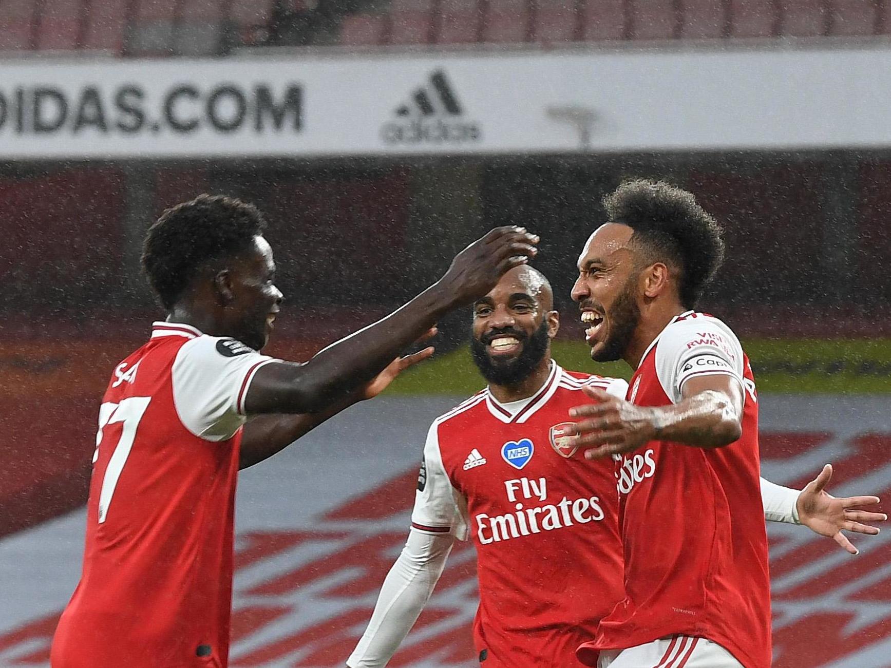 Bukayo Saka, Alexandre Lacazette and Pierre-Emerick Aubameyang celebrate