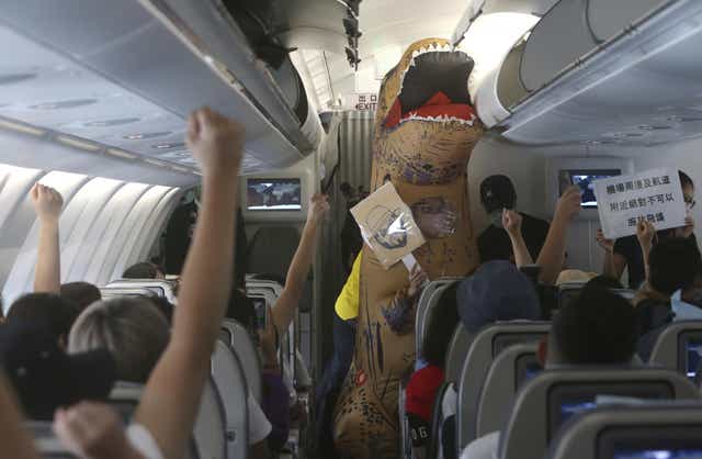 Participants vie to answer a quiz during a fantasy flight in Taipei, Taiwan