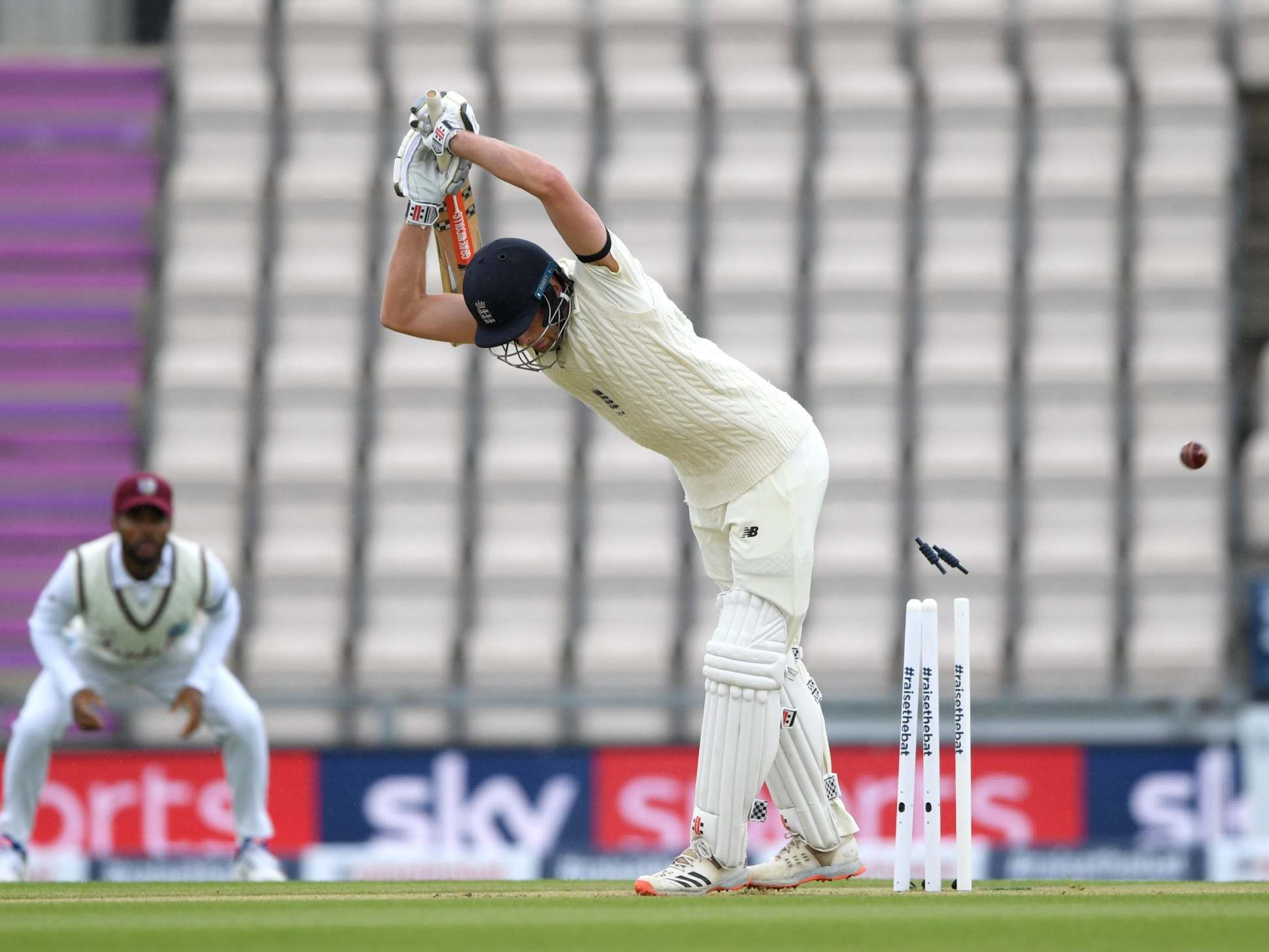 Dom Sibley is bowled by Shannon Gabriel on day one