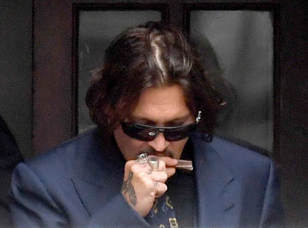 Actor Johnny Depp leaves the High Court in London where he has been giving evidence during a hearing in his libel case against the publishers of The Sun and its executive editor, 9 July 2020.