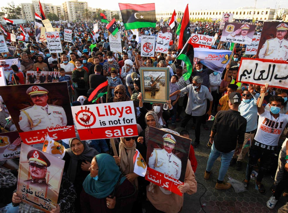 Supporters of Khalifa Haftar take part in a gathering in Benghazi this month