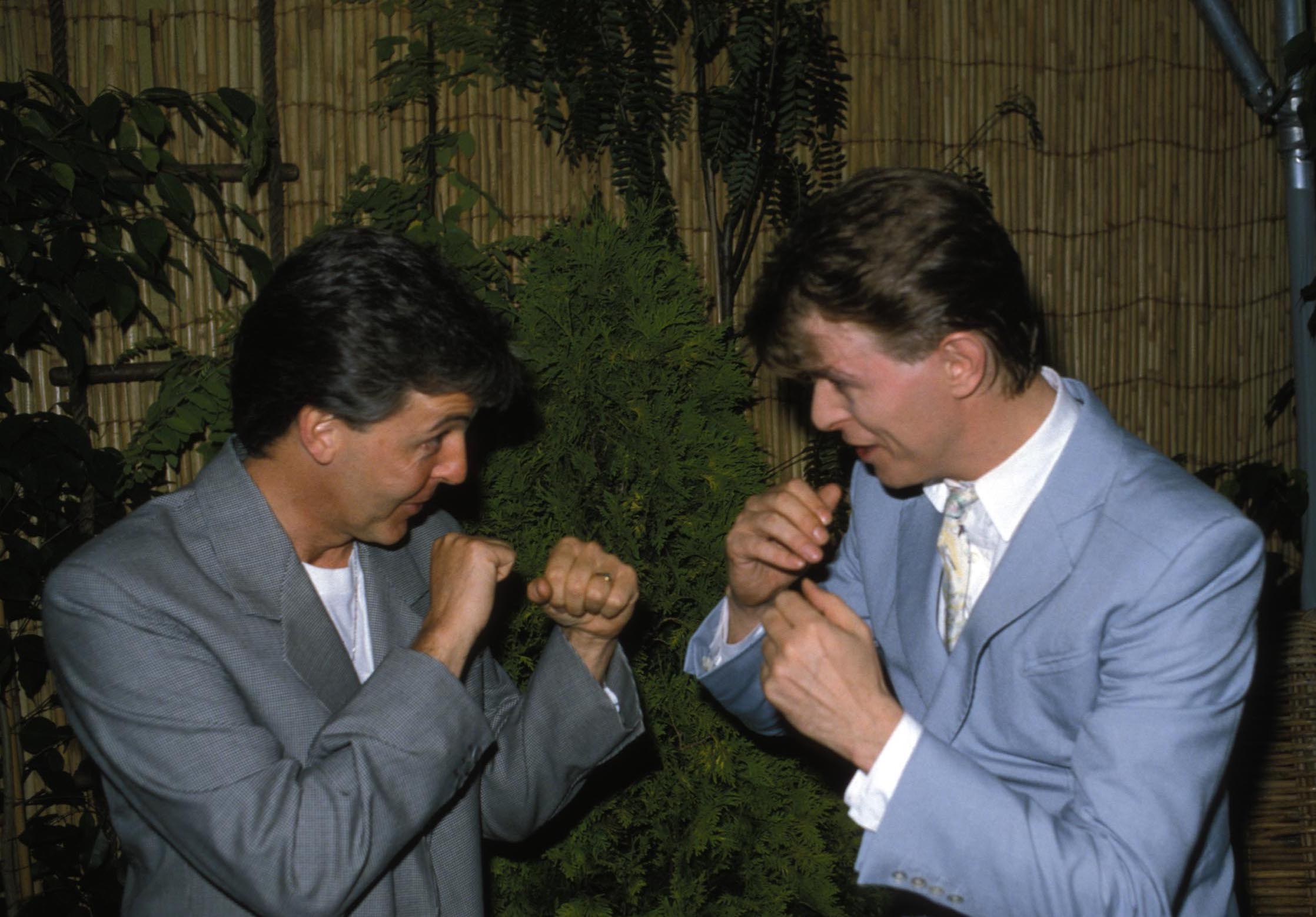 Sparring partners: Paul McCartney and David Bowie pretend to box backstage at Live Aid