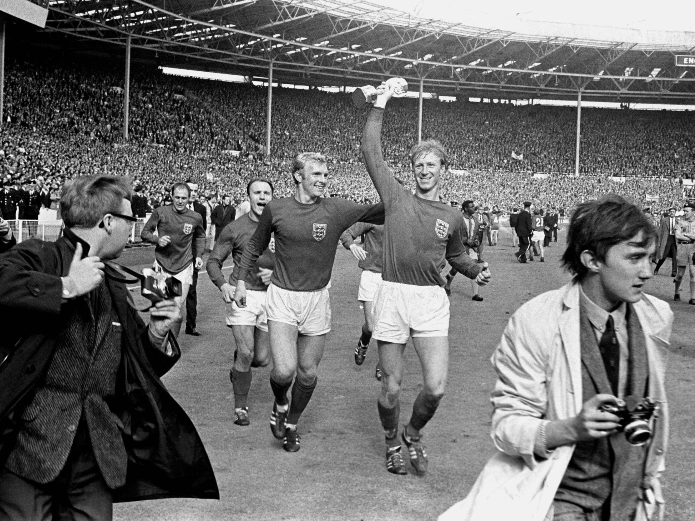 Jack Charlton celebrates with the Jules Rimet trophy following England’s 1966 World Cup final triumph