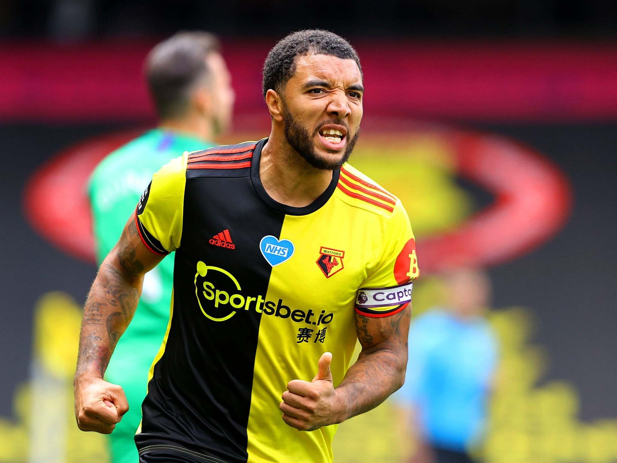 Troy Deeney celebrates after firing home from the penalty spot
