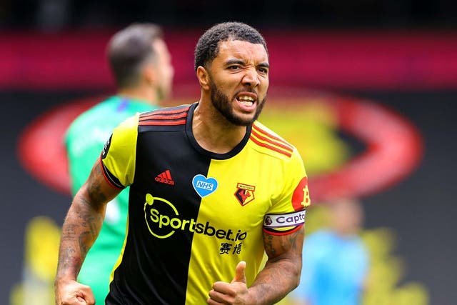 Troy Deeney celebrates after firing home from the penalty spot