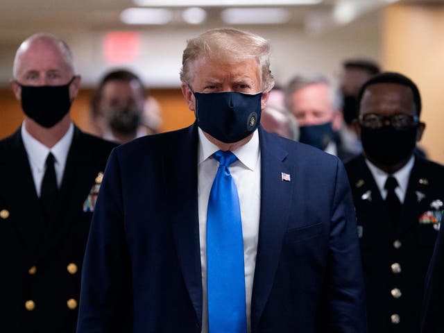 US president Donald Trump  wears a face mask as he arrives to visit wounded military members and front line coronavirus healthcare workers at Walter Reed National Military Medical Centre in Bethesda, Maryland, USA, 11 July 2020.