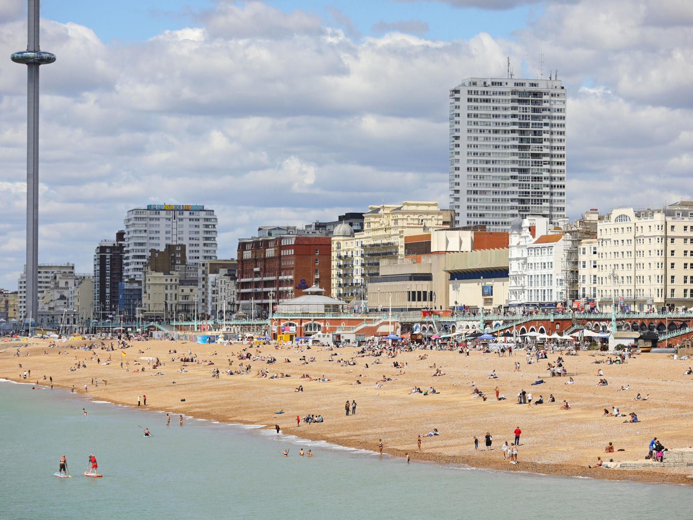 People enjoy the sun at the beach in Brighton on 11 July, 2020.