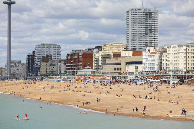 People enjoy the sun at the beach in Brighton on 11 July, 2020.