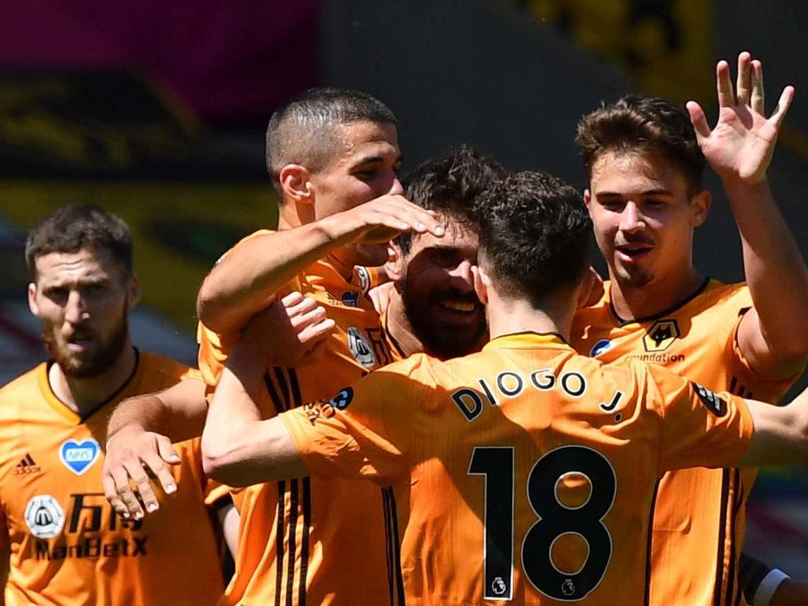 Wolves players celebrate scoring against Everton