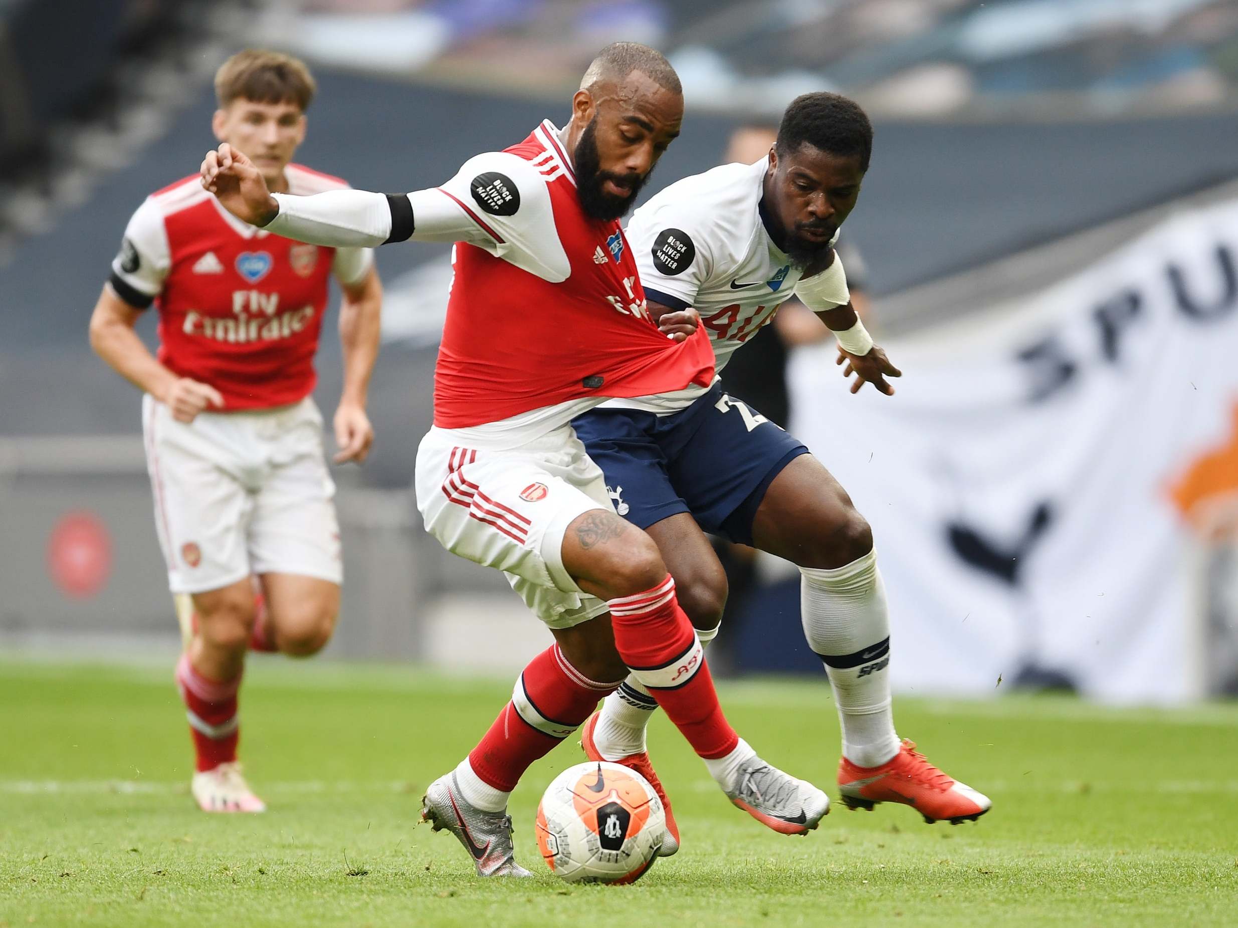 Alexandre Lacazette tries to hold off Serge Aurier