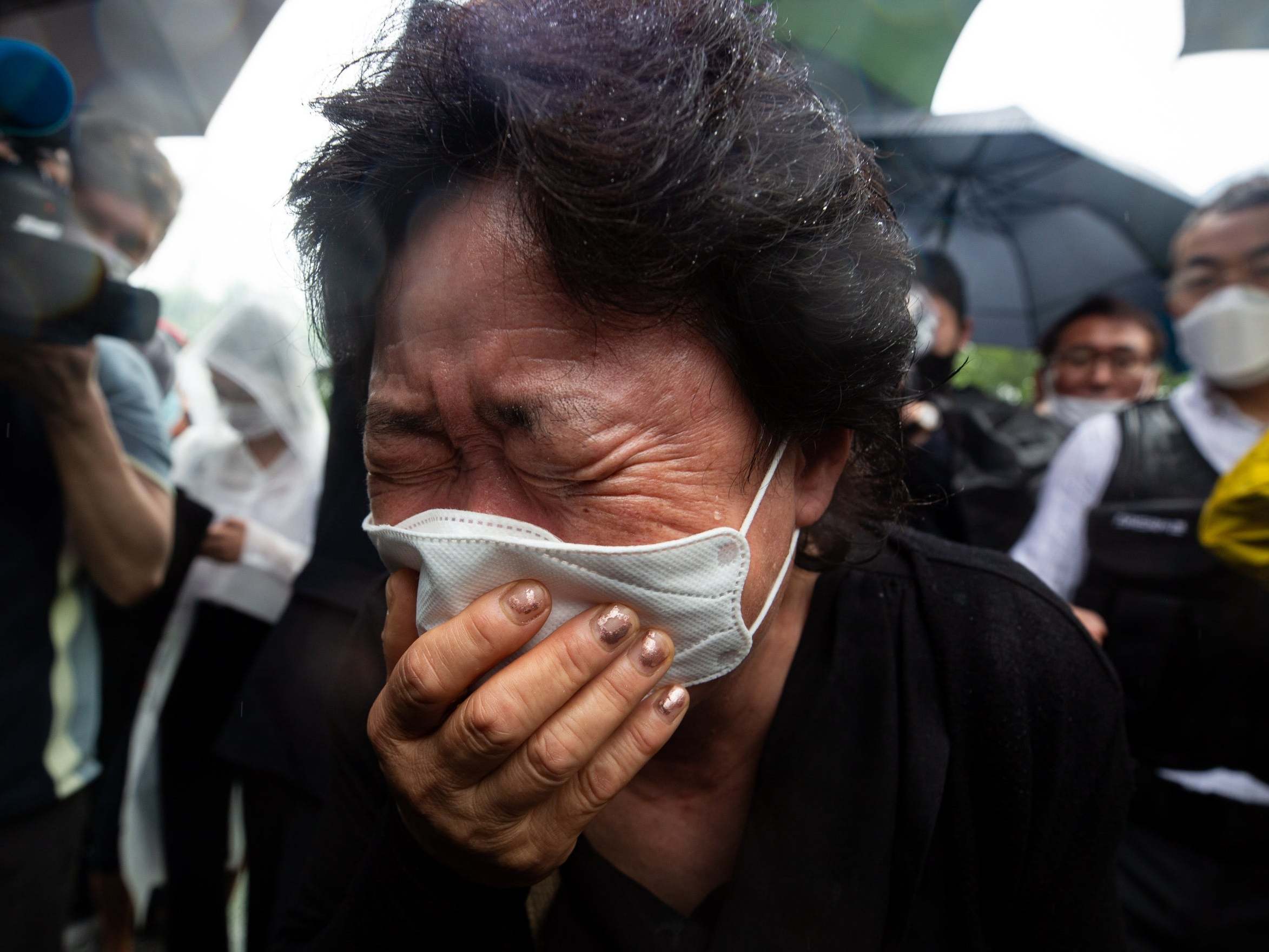 A mourner weeps during the funeral ceremony for late Seoul mayor Park Won-soon, outside Seoul City Hall in Seoul, South Korea, 13 July 2020.