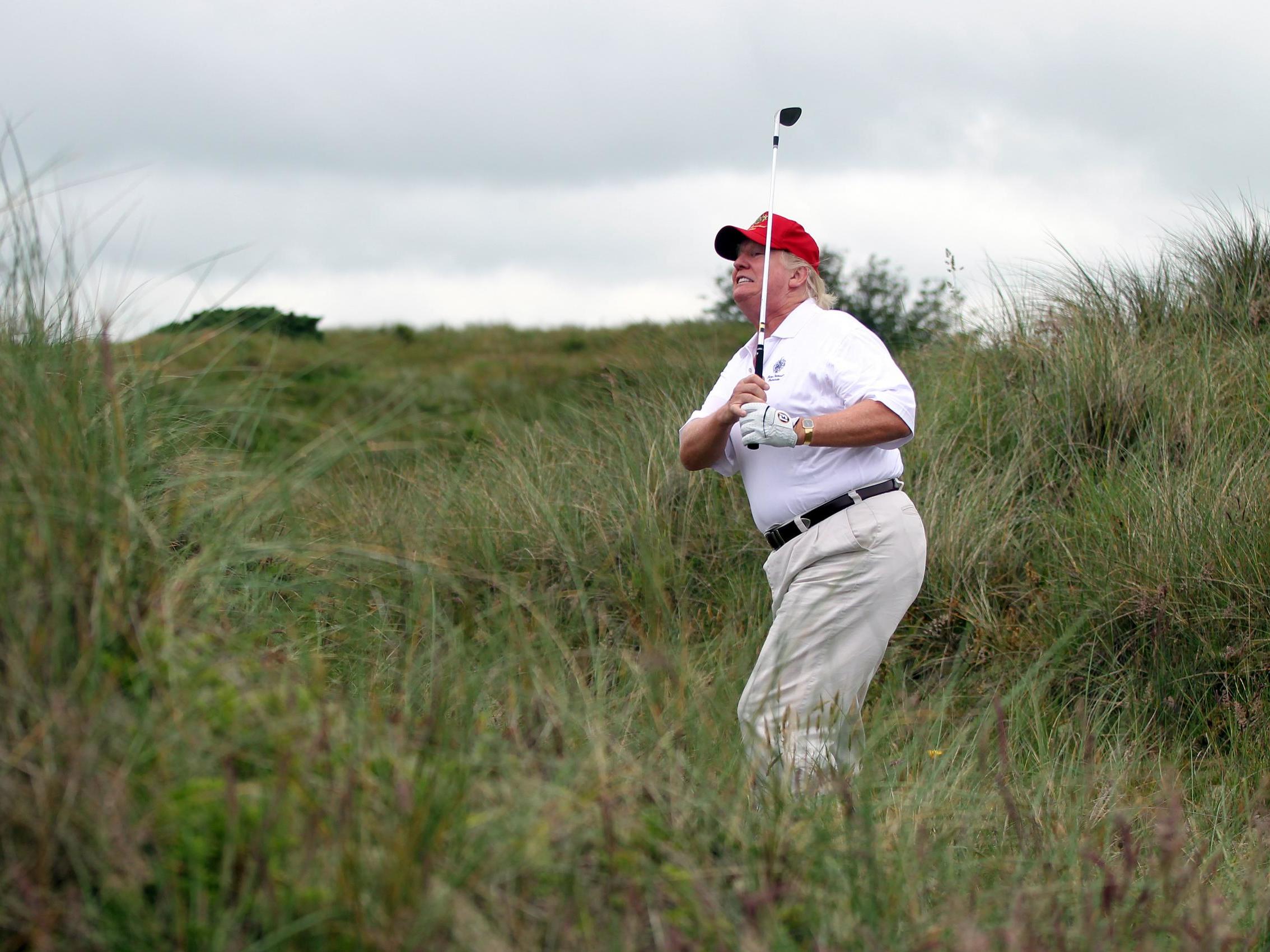 Donald Trump plays a round of golf after the opening of the Trump International Golf Links Course on 10 July, 2012, in Balmedie, Scotland