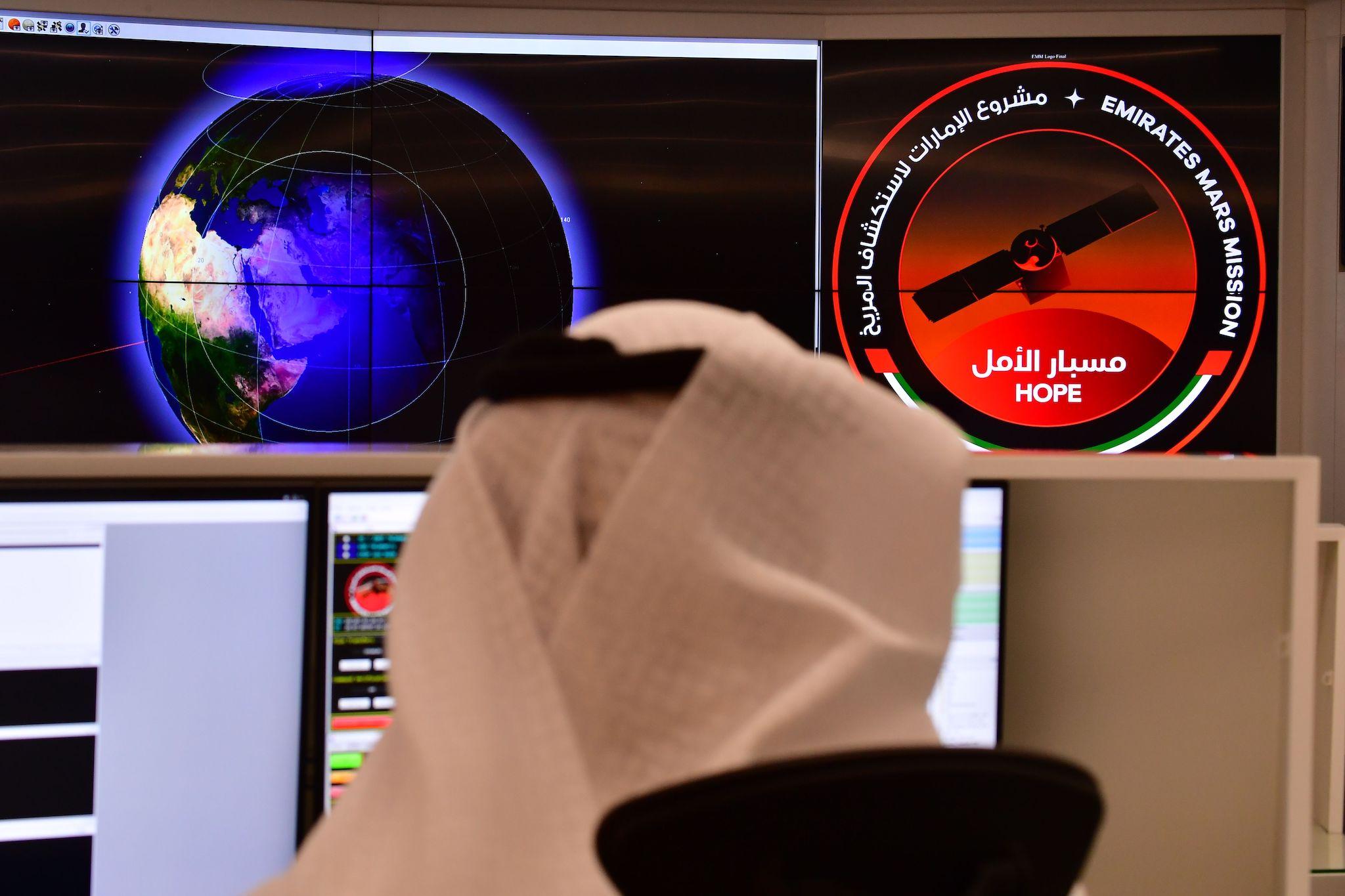 An employee works at the control room of the Mars Mission at the Mohammed Bin Rashid Space Centre (MBRSC), in the Gulf emirate of Dubai