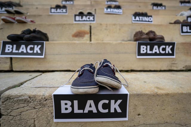 Shoes laid out at the steps of Brooklyn Borough Hall representing victims of gun violence