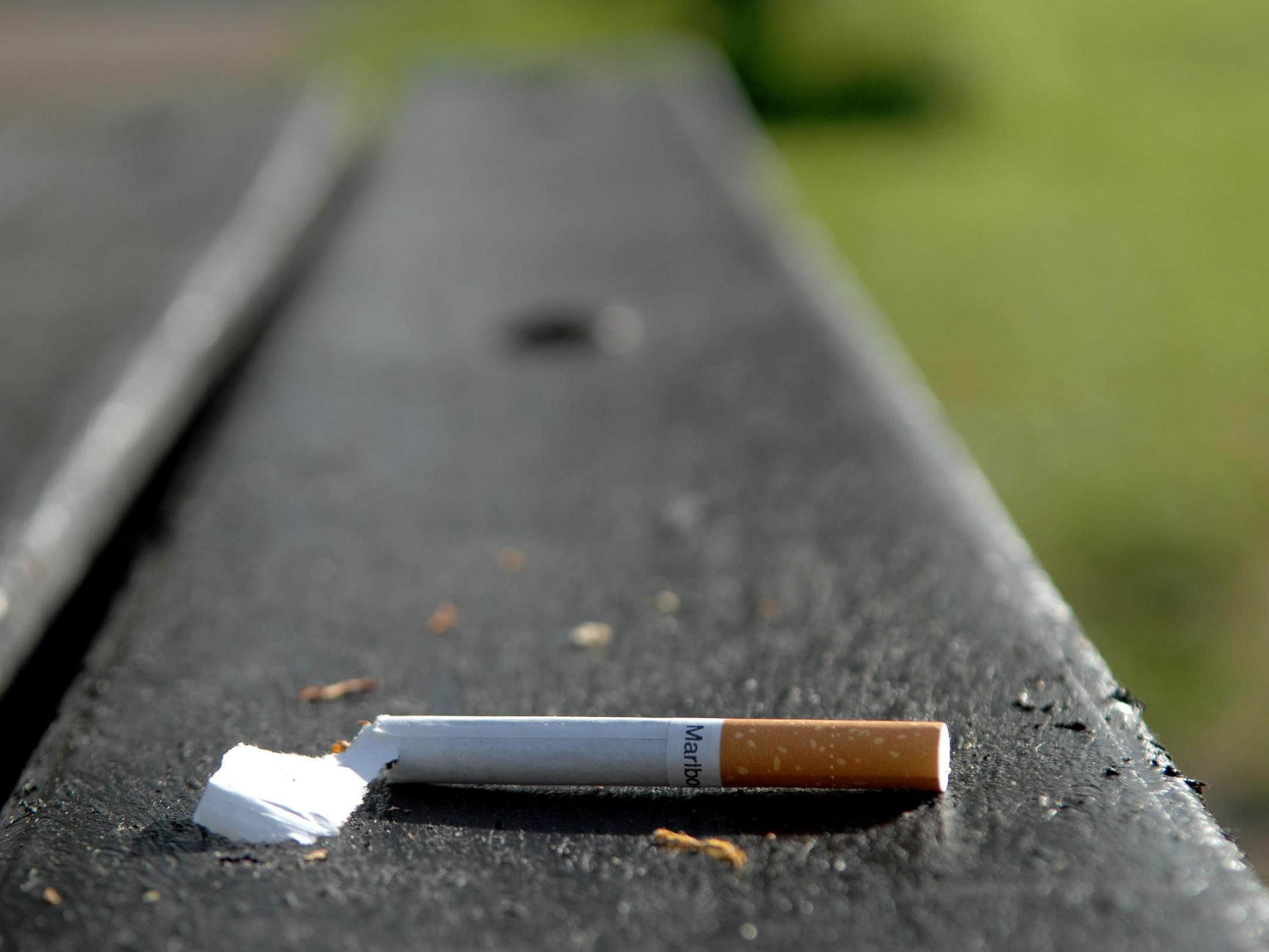 A discarded cigarette left on a bench in Wandsworth Common, London, on 14 April, 2020.