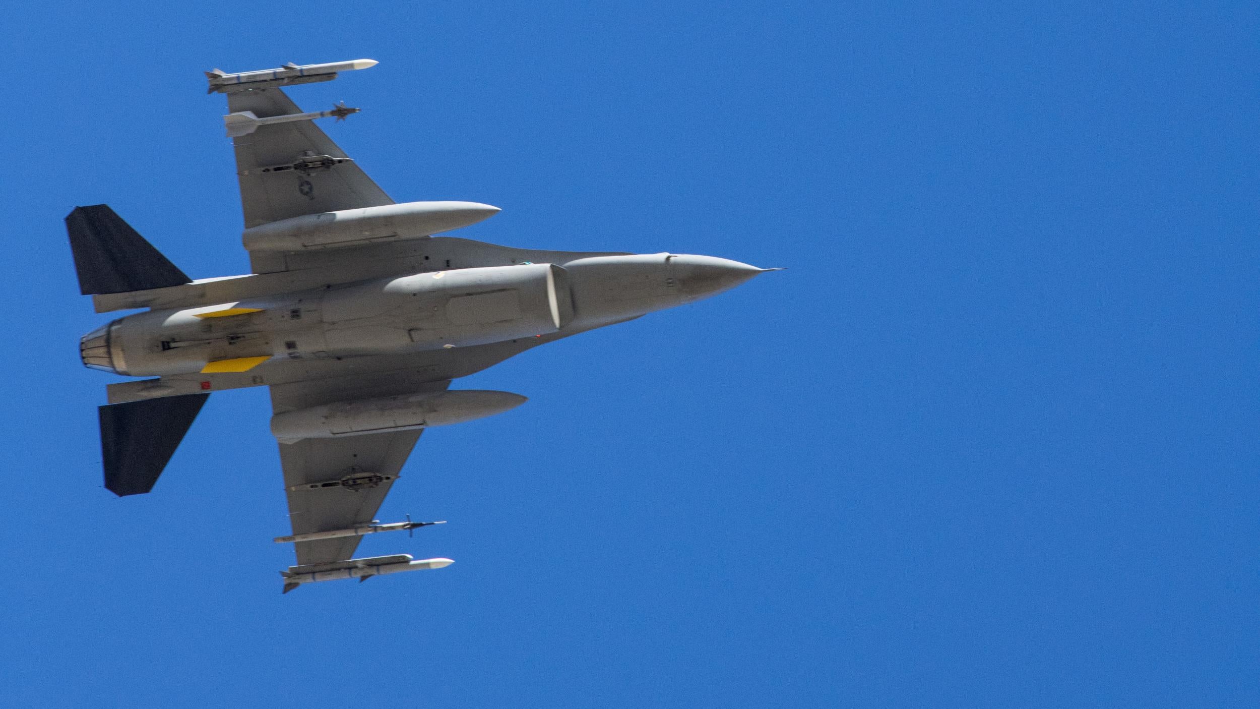 HOLLOMAN AIR FORCE BASE, N.M. - Col. Joseph Campo, 49h Wing commander, piloting the Wing’s F-16 Viper flagship, executes a banking manoeuvre May 15 in the skies over Alamogordo High School in Alamogordo, N.M. The aircraft was part of a four-ship formation of F-16 Vipers from Holloman Air Force Base executing a flyover across southern New Mexico. The flyover was part of the “Air Force Salutes” campaign, honouring front-line workers combating the COVID-19 pandemic in the region.