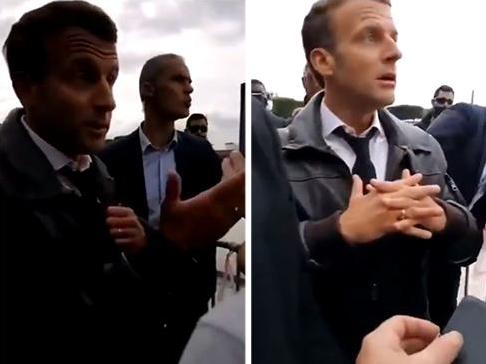 Emmanuel Macron was met with hecklers on a stroll in central Paris on Bastille Day