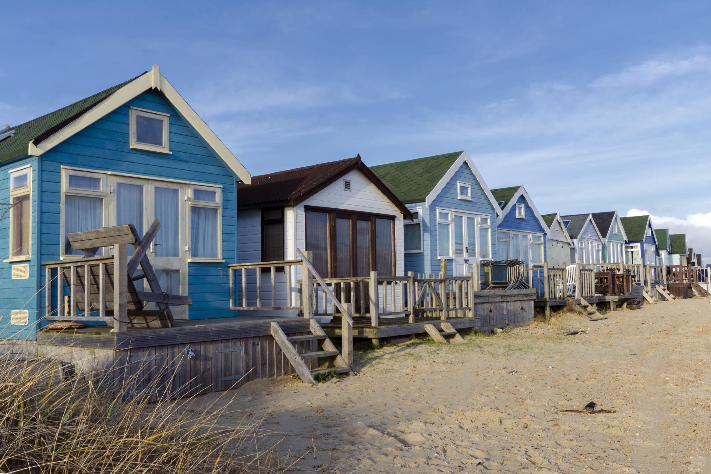 A selection of beach huts on the desirable Budeford spit