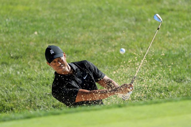 Tiger Woods plays in a practice round at Muirfield Village