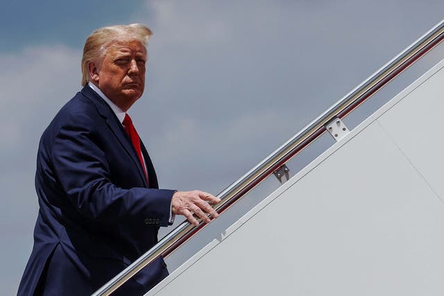 President Trump boards Air Force One as he departs Washington to travel to Atlanta, Georgia at Joint Base Andrews, Maryland on 15 July