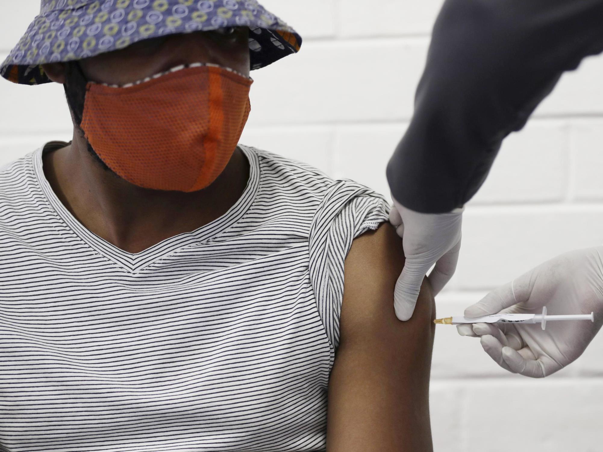 A volunteer receives a Covid-19 test vaccine injection developed at the University of Oxford in Britain, at the Chris Hani Baragwanath hospital in Soweto, Johannesburg, South Africa