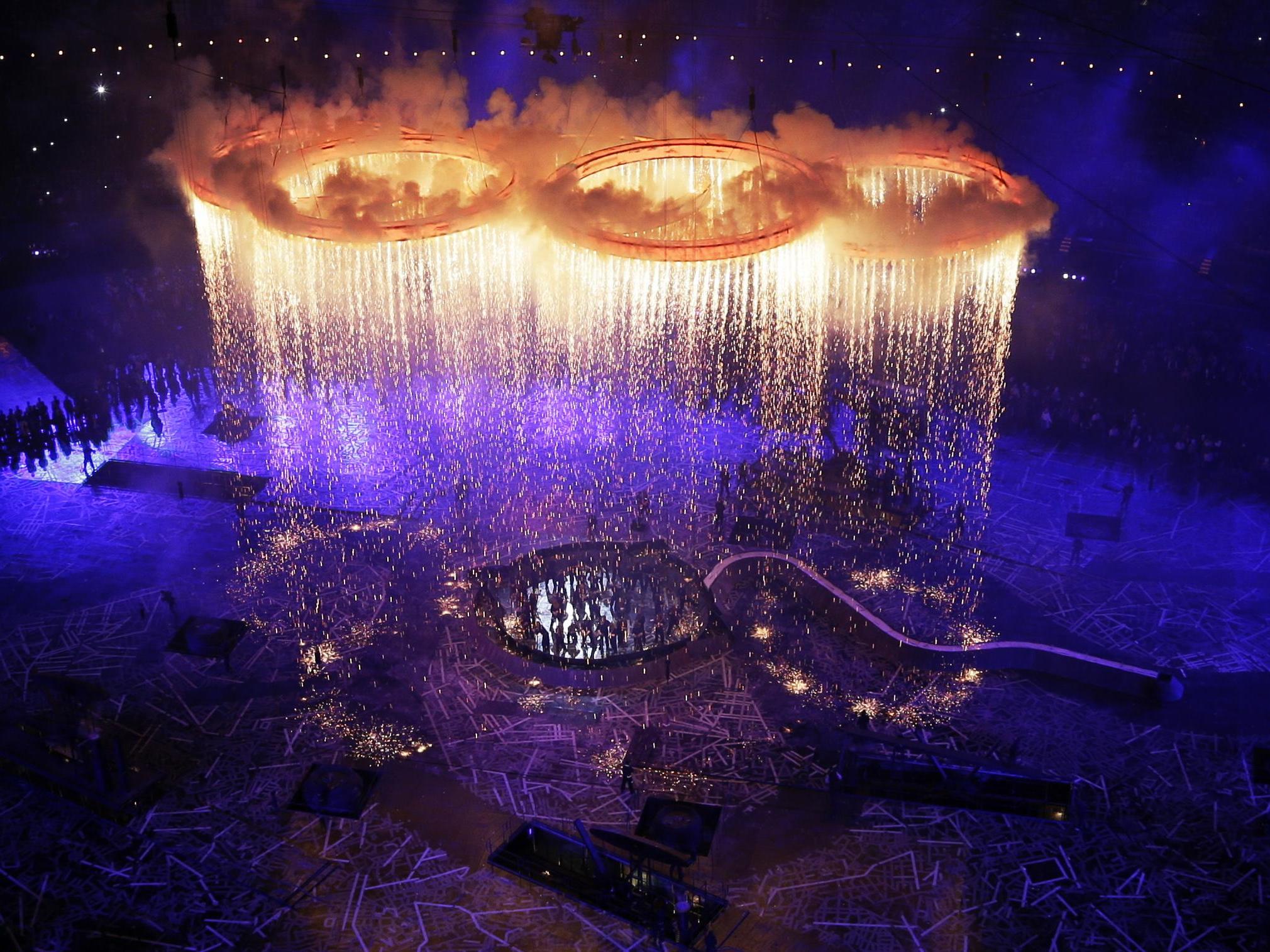 Rings representing the Olympics and the industrial revolution are lit during Danny Boyle's 2012 opening ceremony