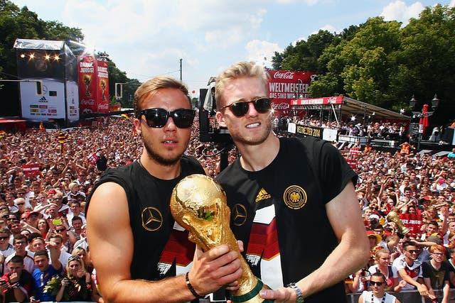 Andre Schurrle, right, with Mario Gotze and the World Cup