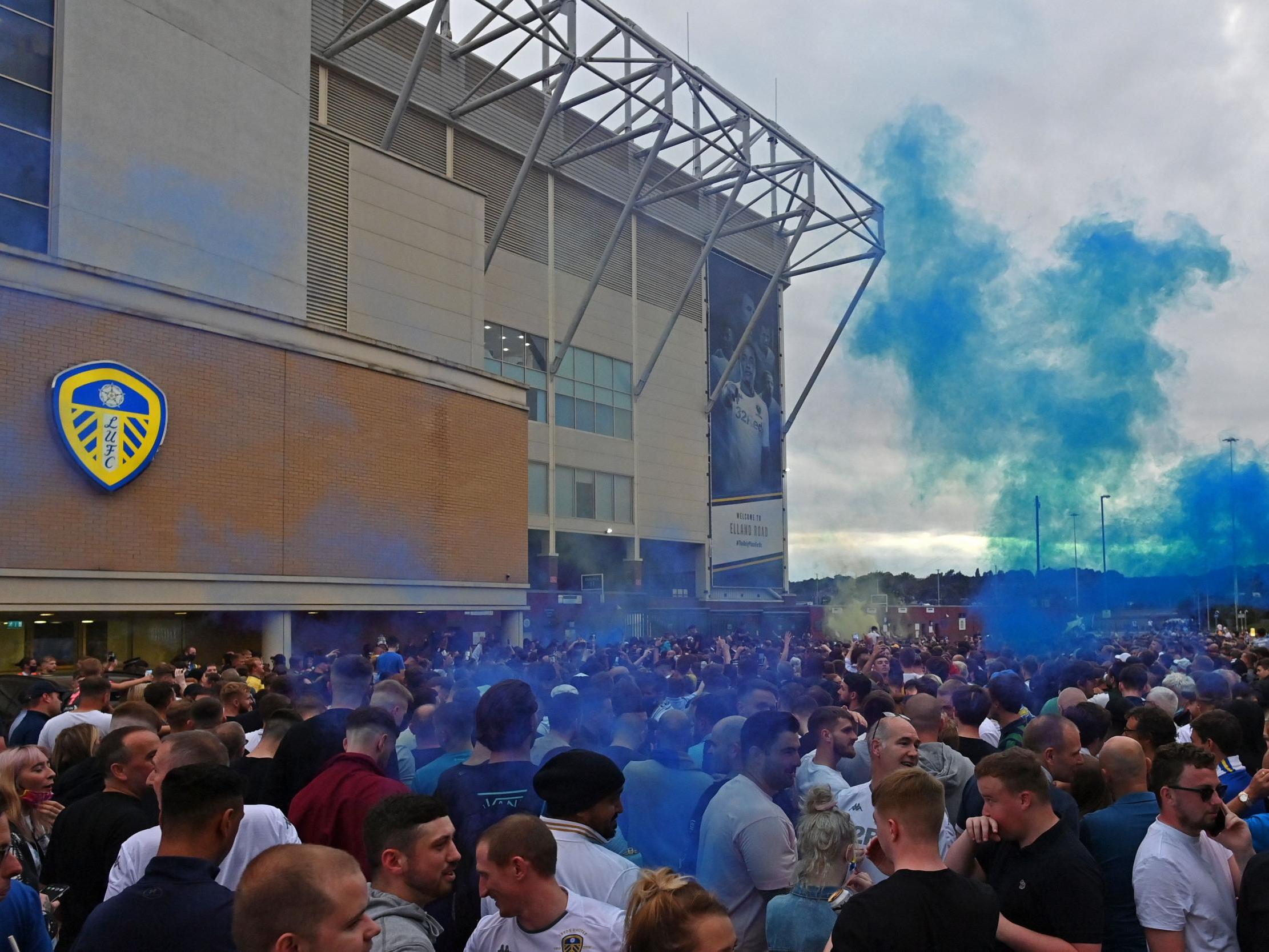 Leeds supporters gather outside Elland Road to celebrate the club's return to the Premier League