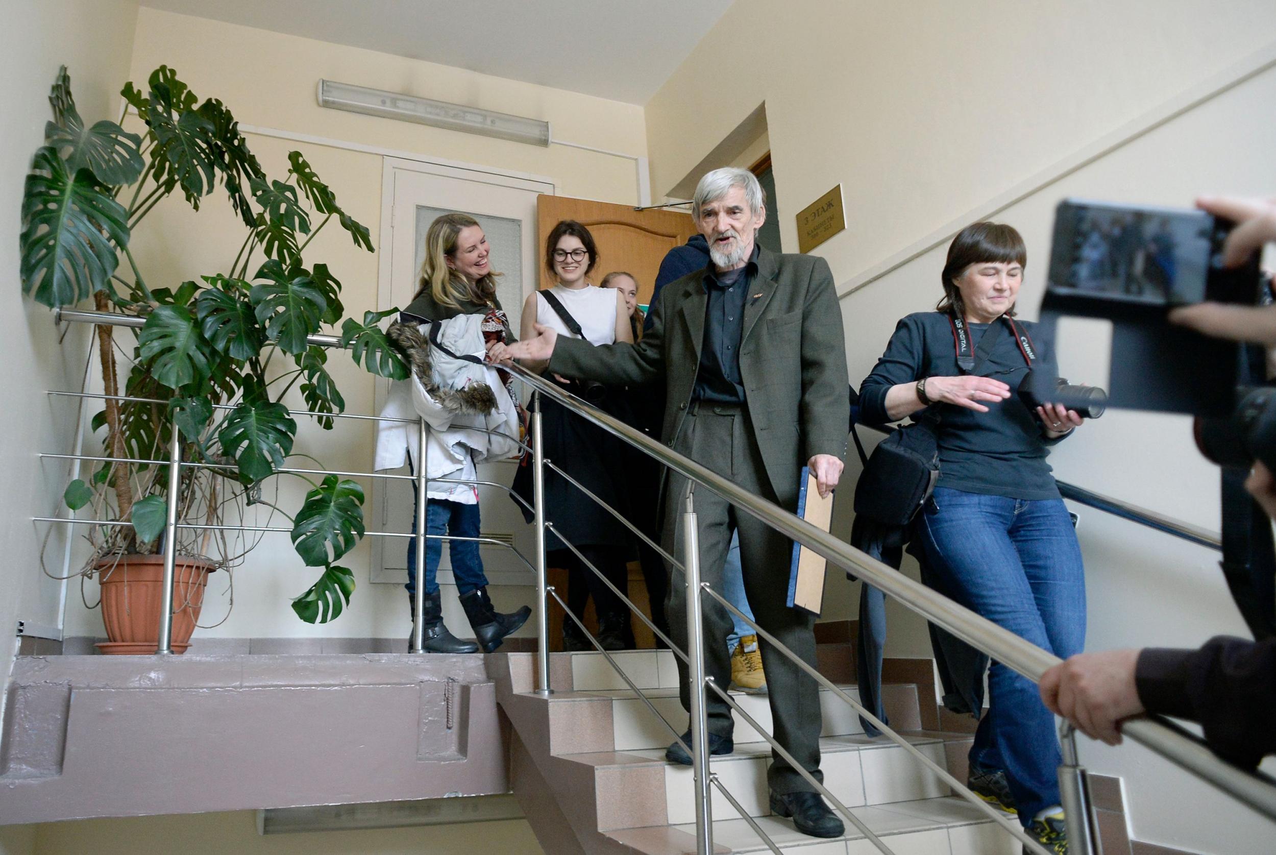 Yury Dmitriyev leaves a court building following the verdict in his child pornography trial in the city of Petrozavodsk (AFP via Getty)