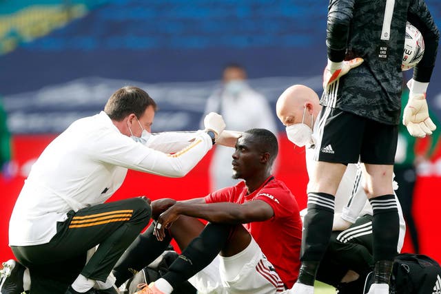 Bailly is attended to after suffering a heavy blow