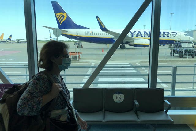 New normal: a passenger wearing a mask at Stansted airport