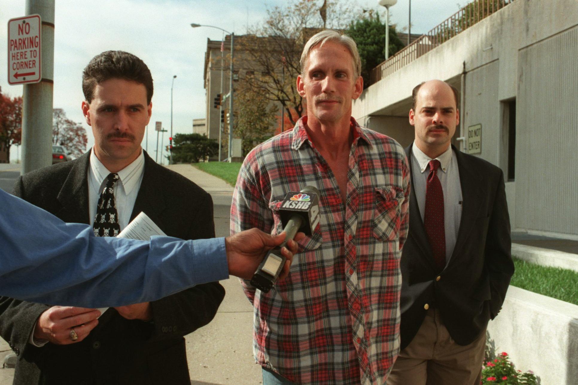 Purkey (centre) is escorted by police officers after he was arrested in connection with the death of 80-year-old Mary Ruth Bales. He was executed last week