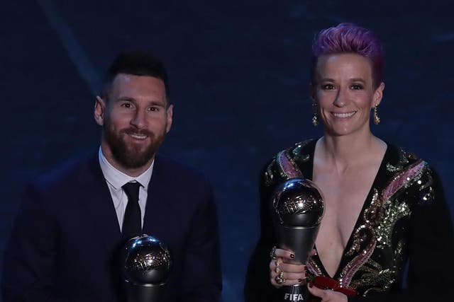 2019 Ballon d'Or winner Lionel Messi (left) with 2019 Ballon d'Or Feminin winner Megan Rapinoe