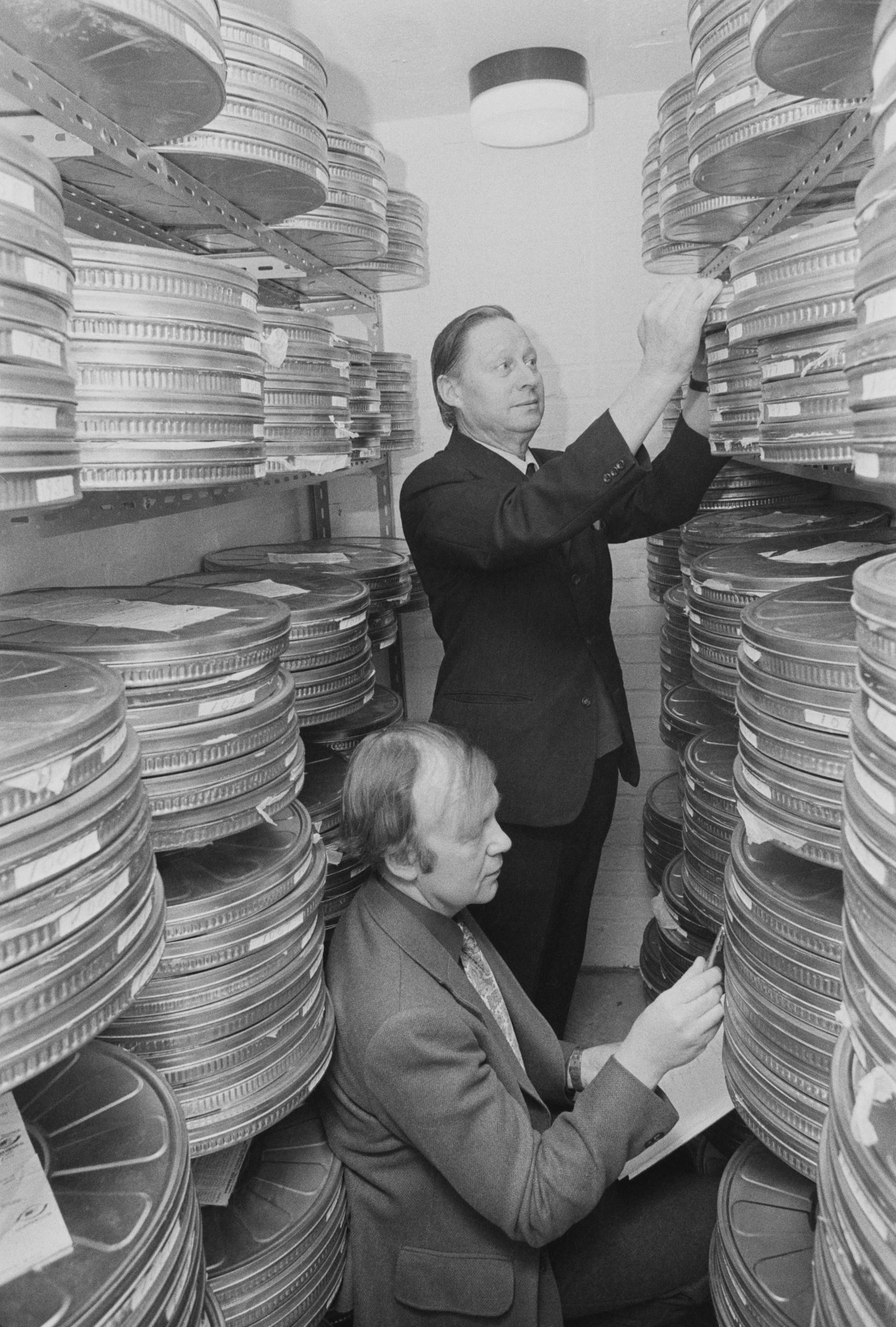 Film preservationists Harold Brown and David Price at work at the National Film Library, known today as the BFI National Archive