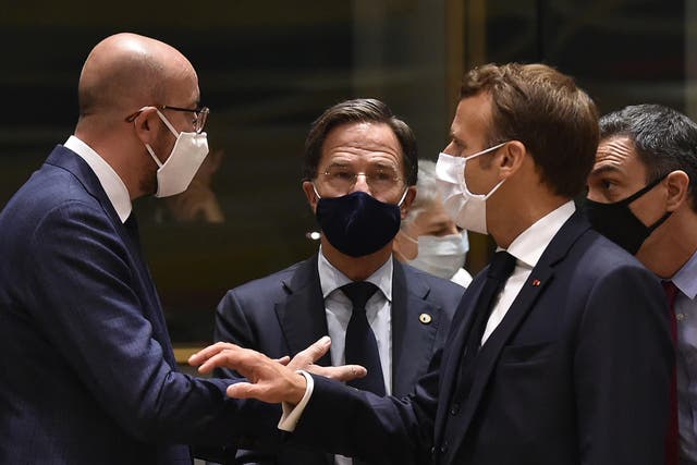 European Council president Charles Michel (left) speaks with Emmanuel Macron (right) and Dutch prime minister Mark Rutte