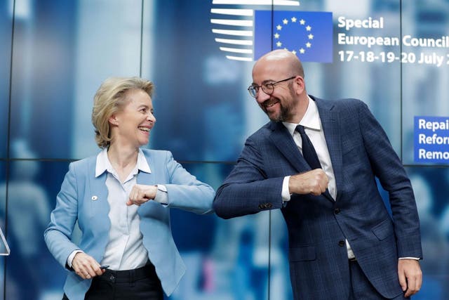 European Commission President Ursula Von Der Leyen (L) and European Council President Charles Michel (R) give a elbow shot at the end of a news conference following a four day European summit at the European Council in Brussels, Belgium, 21 July 2020.