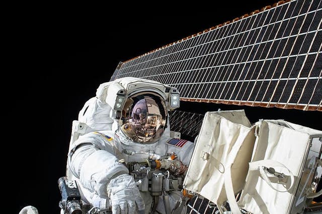 Nasa astronaut Scott Kelly works outside of the International Space Station during a 2015 spacewalk.
