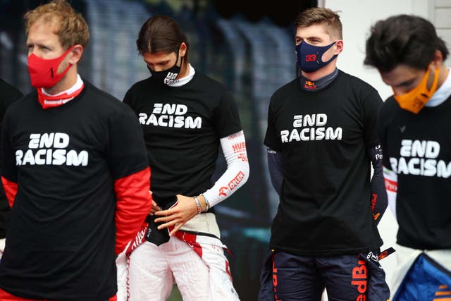 Sebastian Vettel (left) believes F1 need to organise their anti-racism message better before races
