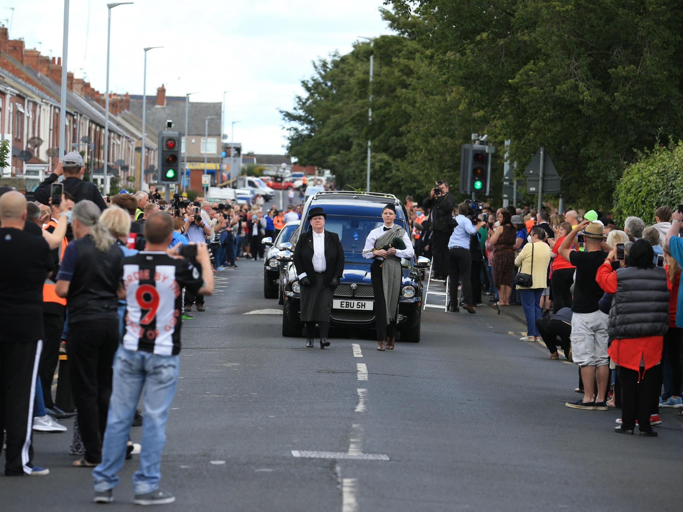 Well wishers line the streets to pay their respects to Big Jack